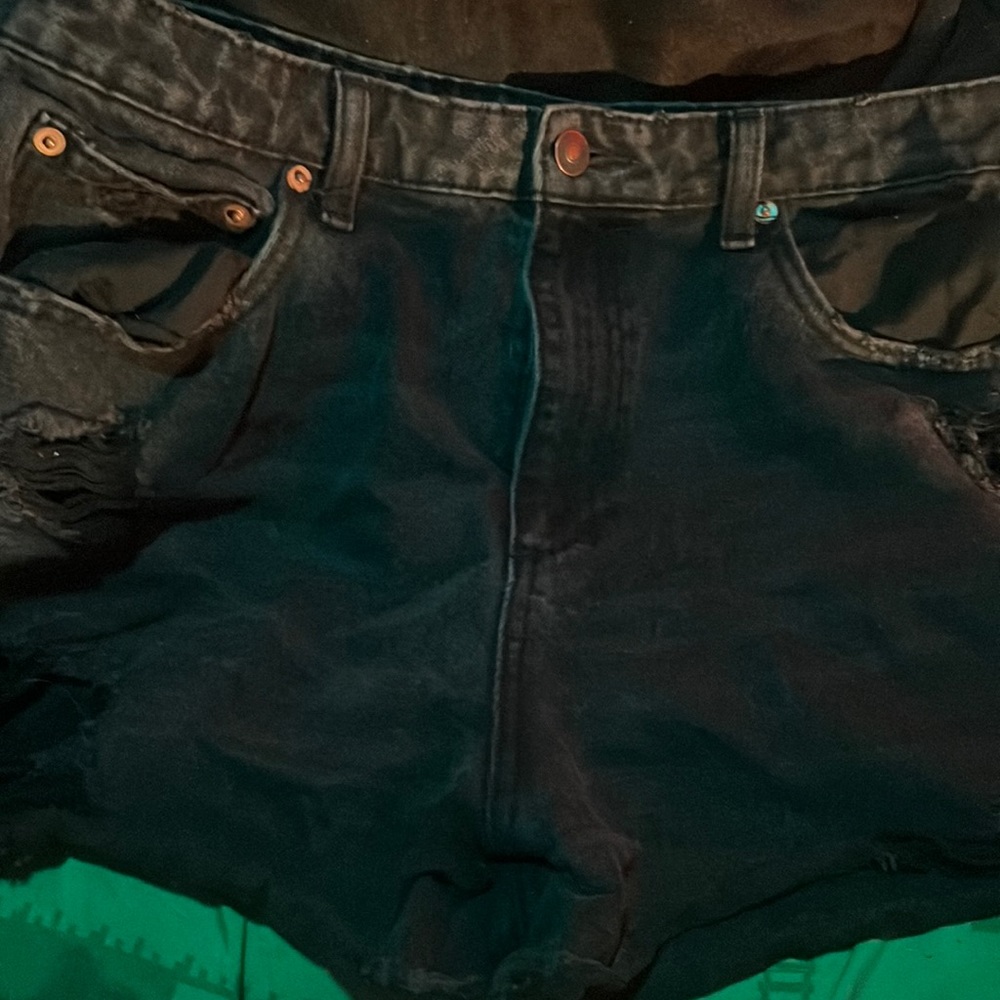 black ripped shorts